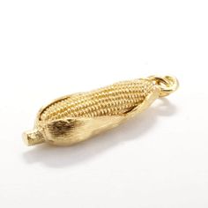 "If she loves the beauty of corn this would be a very unique corn gold charm gift for her charm bracelet, or for someone who is a member of the corn grower association. This piece is a 14kt gold vermeil corn charm with the corn cob showing in front and the corn husk still tight on the cob. I have hand engraved lines on the surrounding corn husk to give it very fine detail and look like actual corn. This is a fully round three dimensional design with details all around Actual size of charm is 1 1 Ear Of Corn, Corn Cob, Ears Of Corn, Corn Husk, Small Rings, Charm Gift, Gold Charm, Hand Engraving, 14kt Gold