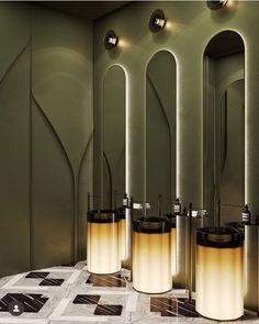 a group of mirrors sitting next to each other on top of a tiled floor in front of green walls