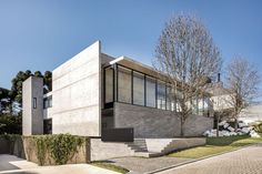 a concrete house with stairs leading up to it