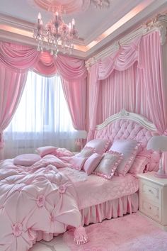 a bedroom decorated in pink and white with chandelier