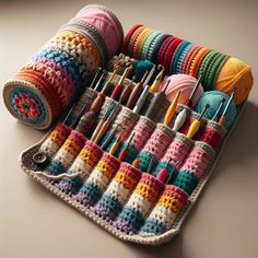 crochet and knitting supplies are arranged in a holder on a table with yarn