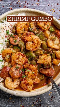 a bowl filled with shrimp, green beans and rice next to a spoon on a table