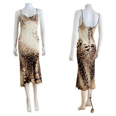 S/S 2002 Roberto Cavalli Dress Leopard animal print on silk Draped neckline Brown braided shoulder straps Slip style Midi length Low scooped upper back Braided corset detail up the back with copper snake head + tail finials Slips on overhead Lined on bust only Marked S, Measurements - Bust 16-17", Waist 13.5", Hips 16-17", Length 47" in front 50" in back /taken flat one side double where appropriate/ Excellent vintage condition, Clean + ready to wear All sales are FINAL so please do not hesitate Robert Cavalli Dress, Luxury Summer Dress With Spaghetti Straps, Luxury Spaghetti Straps Summer Dress, Luxury Summer Dresses With Spaghetti Straps, Snake Clothing, Dress Lace Up Back, Robert Cavalli, Brown Zebra Print, 00s Style