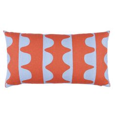 an orange and blue pillow with wavy lines on the front, sitting on a white background