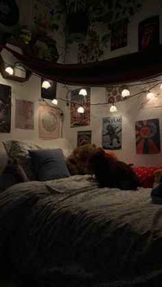 there is a teddy bear that is laying on the bed in this room with lights