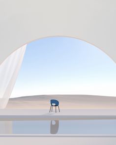 a blue chair sitting on top of a white floor next to an open window in a desert