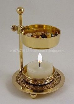 a candle holder with a lit candle in it