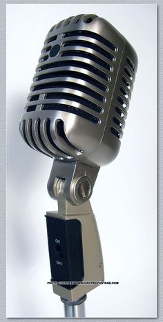 an old fashioned microphone is shown against a white background