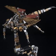 a robot made out of assorted metal parts on a black background with one arm extended