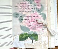 an altered book with pink roses on it