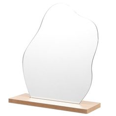 a mirror on a wooden stand with a white background