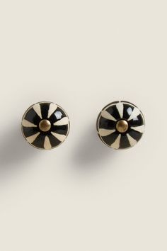 pair of black and white striped earrings