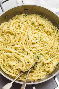 a pan filled with pasta on top of a stove