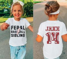 Introducing our Feral Baseball Sibling Kids T-Shirt - the perfect way for baseball brothers and sisters to show their fierce support for their player! ⚾️⚡️ Crafted with everyday wear in mind, this heavy cotton tee is made with premium materials and features a unique design that captures the excitement of the game. Made from 100% midweight US cotton, this tee feels soft to the touch and is a great choice for any season. The crew neckline and classic fit deliver a timeless style that's perfect for White Sports Fan T-shirt With Lettering, School Spirit Tops With Name Print For Baseball Season, Sibling Softball Shirts, Baseball Shirts Sister, Custom Baseball Shirt With Kid Picture, Sibling Baseball Shirts, Baseball Fan Shirts, Toddler Baseball Shirt, Baseball Team Banner