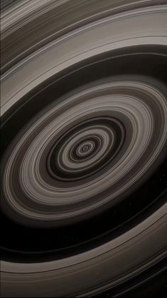 saturn's rings are spinning in the same direction