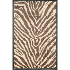 a brown and white rug with zebra print