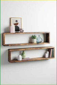 two wooden shelves with plants and vases on them