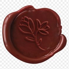 a wax stamp with leaves on it