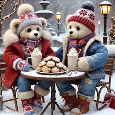 two teddy bears sitting at a table with cookies and coffee