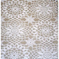 an image of white lace with flowers on it