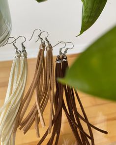 ♡ Our unique and handcrafted suede tassel earrings are perfect for any occasion. They are comfortable and very light. ♡ Each earring is made from silver plated earring hooks and suede. ♡ Care instructions: - Try to avoid wearing them in shower, pool, spa or to bed. ♡ !! Shipping Is Untracked!! Message me if you have any questions or concerns 💕 Cheap Beaded Tassel Dangle Earrings, Cheap Dangle Tassel Jewelry, Cheap Metal Dangle Tassel Earrings, Cheap Tassel Earrings With Dangling Beads For Gifts, Cheap Tassel Dangle Jewelry, Cheap Bohemian Dangle Tassel Earrings, Affordable Handmade Bohemian Tassel Earrings, Dyi Tassel Earrings, Elegant Brown Adjustable Tassel Earrings