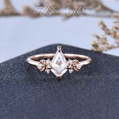 a rose cut diamond ring sitting on top of a rock