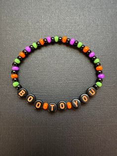 Boo To You beaded stretchy bracelet with glass seed beads in Halloween colors. Perfect for MNSSHP!  Bracelets are available in a variety of lengths.  Pick your custom length from the drop down menu below.  Please be aware that beading may slightly differ from what is pictured as to accommodate selected sizing.  All our bracelets are made with quality in mind.  With that being said, all bracelets should be treated with care while putting on, wearing, and taking off.  Keep dry. Do not swim or bath Halloween Friendship Bracelet Beads, Spooky Bracelet Ideas, Halloween Kandi Ideas, Halloween Seed Bead Bracelet, Bracelet Ideas Halloween, Seasonal Bracelets, Bracelet Ideas Seed Beads, Halloween Beaded Bracelet, Fall Bracelet Ideas