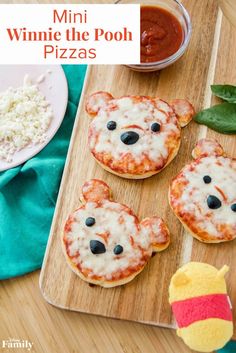 mini winnie the pooh pizzas on a cutting board