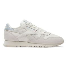 Reebok Women's CLASSIC LEATHER Fashion Sneakers feature a leather upper with suede overlays. EVA midsole. High-abrasion-resistant rubber outsole. Textile lining. Chalk - Vintage Chalk - Feel Good Blue women fashion sneakers athleisure running training casual retro Size: 7.5.  Color: White.  Gender: female.  Age Group: adult. Classic Reebok Shoes, White Sneakers Reebok, Classic Leather Reebok, Women Fashion Sneakers, Fashion Sneakers Women's, Reebok Classic White Sneaker, Reebok Classic Leather Black, Wide Sneakers, White Fashion Sneakers