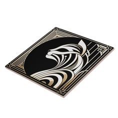 a black and white tile with a horse design on the bottom, in an art deco style