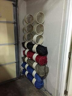 a stack of buckets sitting on top of a metal rack