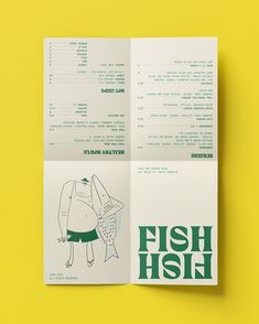 an open brochure with a drawing of a fish on it