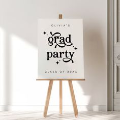 an easel with a sign that says grad party class of 20x7