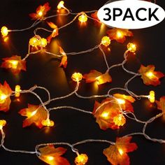 an image of autumn leaves with lights on them