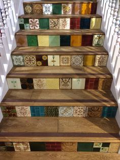 the stairs are decorated with colorful tiles