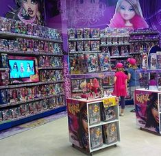 there are many toys on display in the store for children to play and watch tv