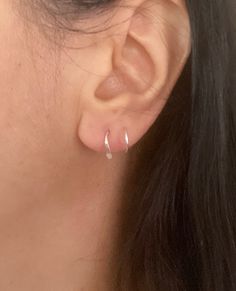 A pair of double open hoop hammered teardrop small earrings, fake double piercing hoops in sterling silver, 14k yellow or rose gold filled. These spiral hoops give the illusion of a second piercing (only one piercing is needed). The inner diameter of the hoops is about 9mm. The second ring that climbs up the ear is a bit smaller. The hoops are hypoallergenic, nickel and lead free. Note - the image on the photo is bigger than the actual size of the item to show details clearly. Please refer to the given measurements for the true size of the item. The item comes gift wrapped and bubble wrapped. Double Hoop Piercing, Hoop Piercing, Double Piercing, Second Piercing, Double Hoop Earrings, Small Earrings, Silver Pieces, Jewelry Earrings Hoops, The Ear