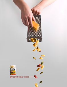 a person grating cheese into a grater