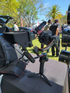 the camera is sitting on top of a tripod in front of some other equipment