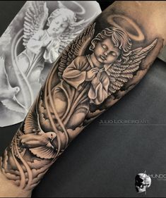 an angel tattoo on the arm