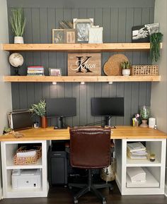 a home office with two desks and shelves