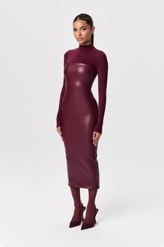 Our stretchy faux leather midi dress is a winter essential. Features a tube design with a straight neckline and a body-con finish. Back zipper closure makes it simple to put on. Style with our amazing boots and coats to create must-have outfits. Vegan Leather Collection Import Self: 60% PU, 35% Rayon, 5% Spandex Lining: 80% Nylon, 20% Spandex Model wears size XS True to size Unusual Fashion, Tube Midi Dress, Leather Midi Dress, Burgundy Midi Dress, Tube Design, Leather Outfits, Swim Shop, Straight Neckline, Wardrobe Inspiration