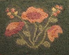 a close up of a rug with flowers on it