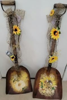 two wooden vases decorated with sunflowers and lace