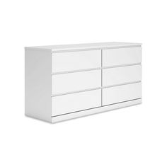 a white dresser with four drawers on it