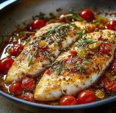 some fish with tomatoes and herbs in a bowl