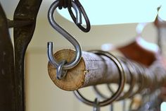 a metal rack with several pieces of wood hanging from it