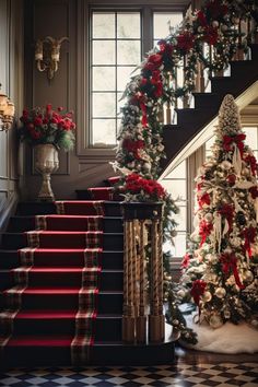 a staircase decorated for christmas with red and white decorations