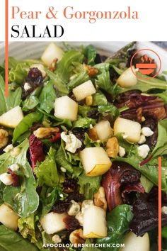 a salad with pears and gorgonzola on it in a white bowl