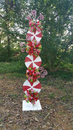 a christmas decoration made out of candy canes and bows